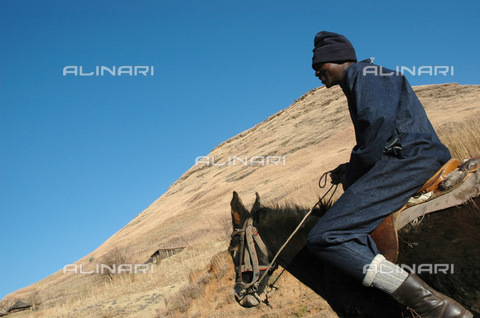 APN-F-026793-0000 - Lesotho 2004  Rural  man on Lesotho ponyGraeme Williams/South - South Photographs / Africamediaonline/Archivi Alinari, Firenze