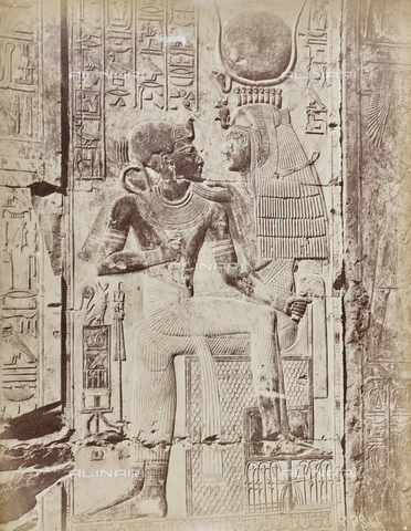 AVQ-A-000523-0056 - Pharaoh on the knees of a deity, relief, Temple of Seth, Abid, Egypt - Date of photography: 1880 - 1890 - Alinari Archives, Florence