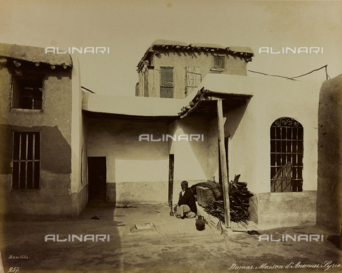 AVQ-A-001581-0015 - Album "Damas et Baalbek": Portrait of an old man smoking a hookah in front of the house of Saint Ananias in Damascus - Date of photography: 1880 ca. - Alinari Archives, Florence