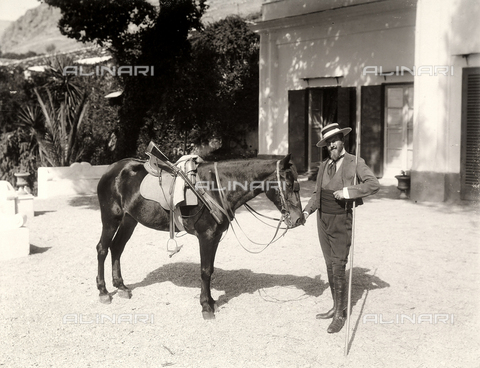 AVQ-A-003698-0003 - Male portrait photographed at the farm "Lo Zucco" in Sicily, property of Roberto Luigi Filippo d'Orleans; he is seen here together with his horse. - Date of photography: 1900 - Alinari Archives, Florence