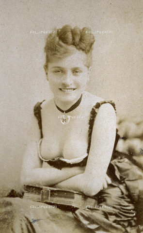 FBQ-A-006270-0243 - Three-quarter-length portrait of young woman scantily dressed. She is smiling suggestively generously showing her cleavage - Date of photography: 1860 -1870 ca. - Alinari Archives, Florence