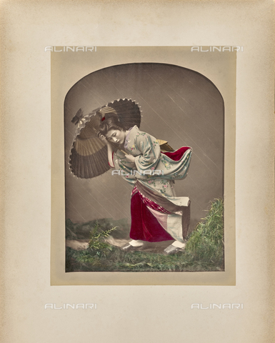 FVQ-F-219507-0000 - Woman with umbrella in the rain - Date of photography: 1870-1879 - Alinari Archives, Florence