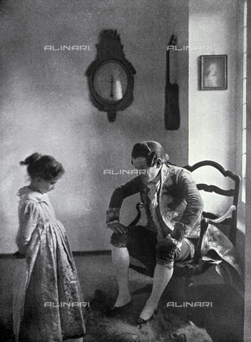 LOB-S-000924-0001 - In a 18th century setting a gentleman in elegant embroidered tail coat and wig scolding a small girl. She looks sad and ashamed and is looking down, frightened by the young man's severe look - Date of photography: 1923-1924 - Alinari Archives, Florence