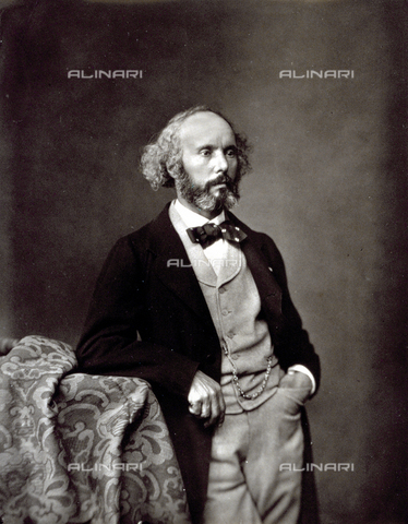 PDC-S-000312-0003 - Portrait of Félicien David standing up. The composer who has a beard and moustache, is dressed in a long jacket, vest and tie. The man is leaning on one elbow, his left hand in his pocket, and he is looking away from the camera - Date of photography: 1860-1865 - Alinari Archives, Florence