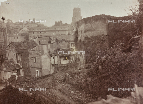 REA-F-000170-0000 - View of buildings in the Capitol that were demolished during the refurbishment of the Piazza Venezia at the Vittoriano in Rome building. In the background Tower of the Militias - Date of photography: 1880-1890 ca. - Alinari Archives, Florence