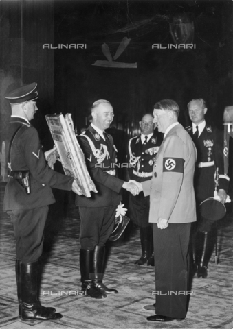 WHA-S-WHA041-0797 - Adolf Hitler presented with a painting from SS Chief Heinrich Himmler, circa 1937. - World History Archive/Archivi Alinari